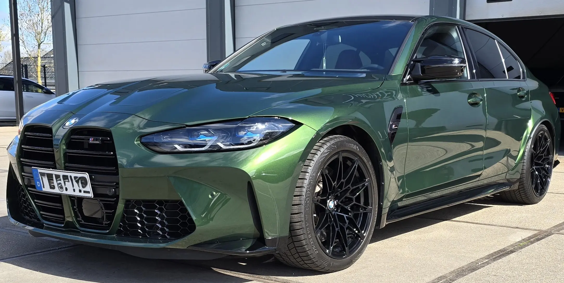 Groene BMW M3 Competition voorzijde